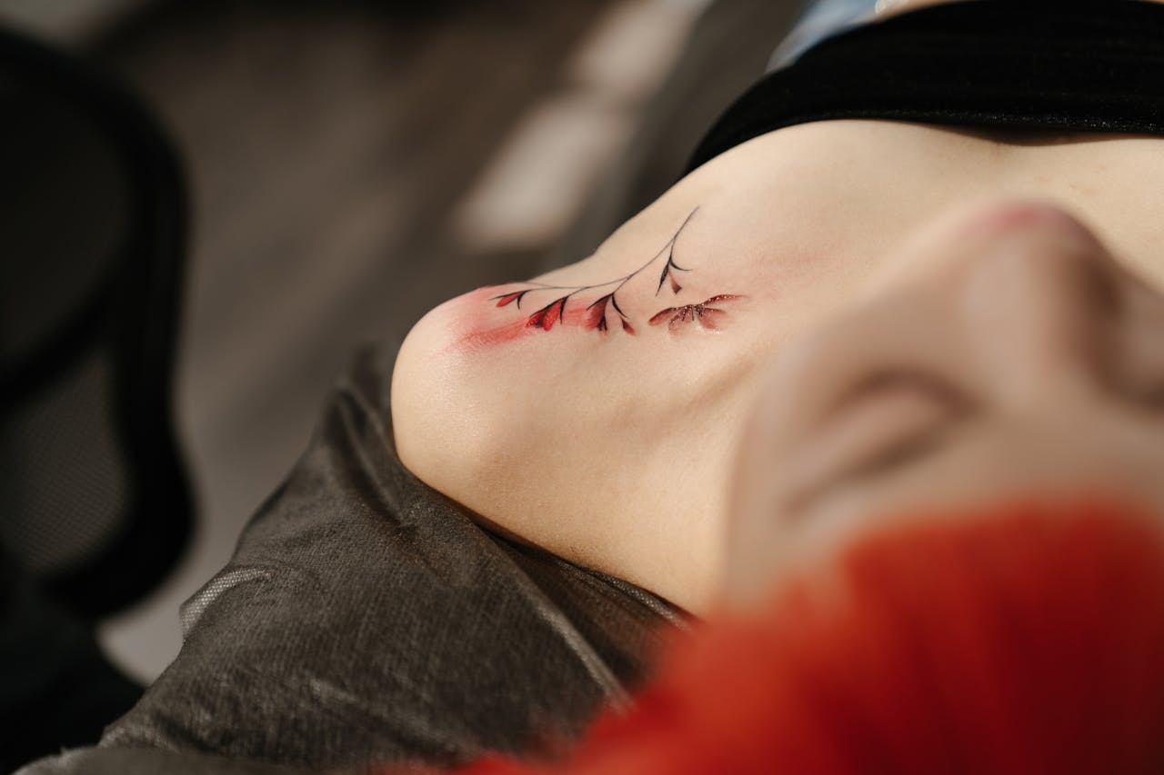 Artful shoulder tattoo in a tattoo studio setting. Captures detail and creativity.